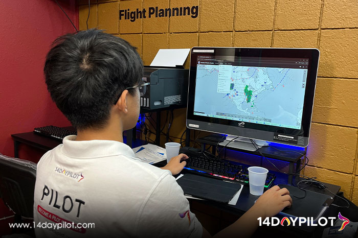 14DAYPILOT student engaged in pre-flight planning.