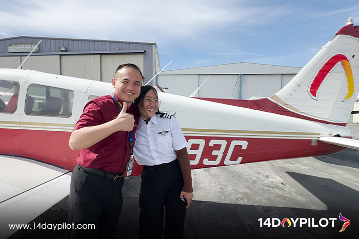 Flight instructor congratulates female student on checkride success